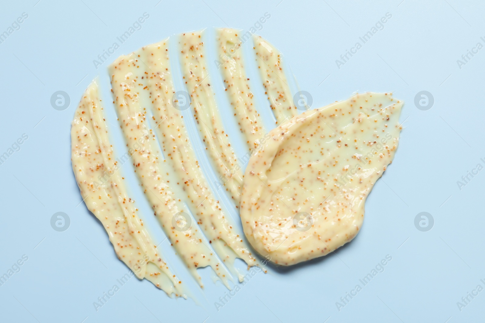 Photo of Sample of body scrub on light background, top view