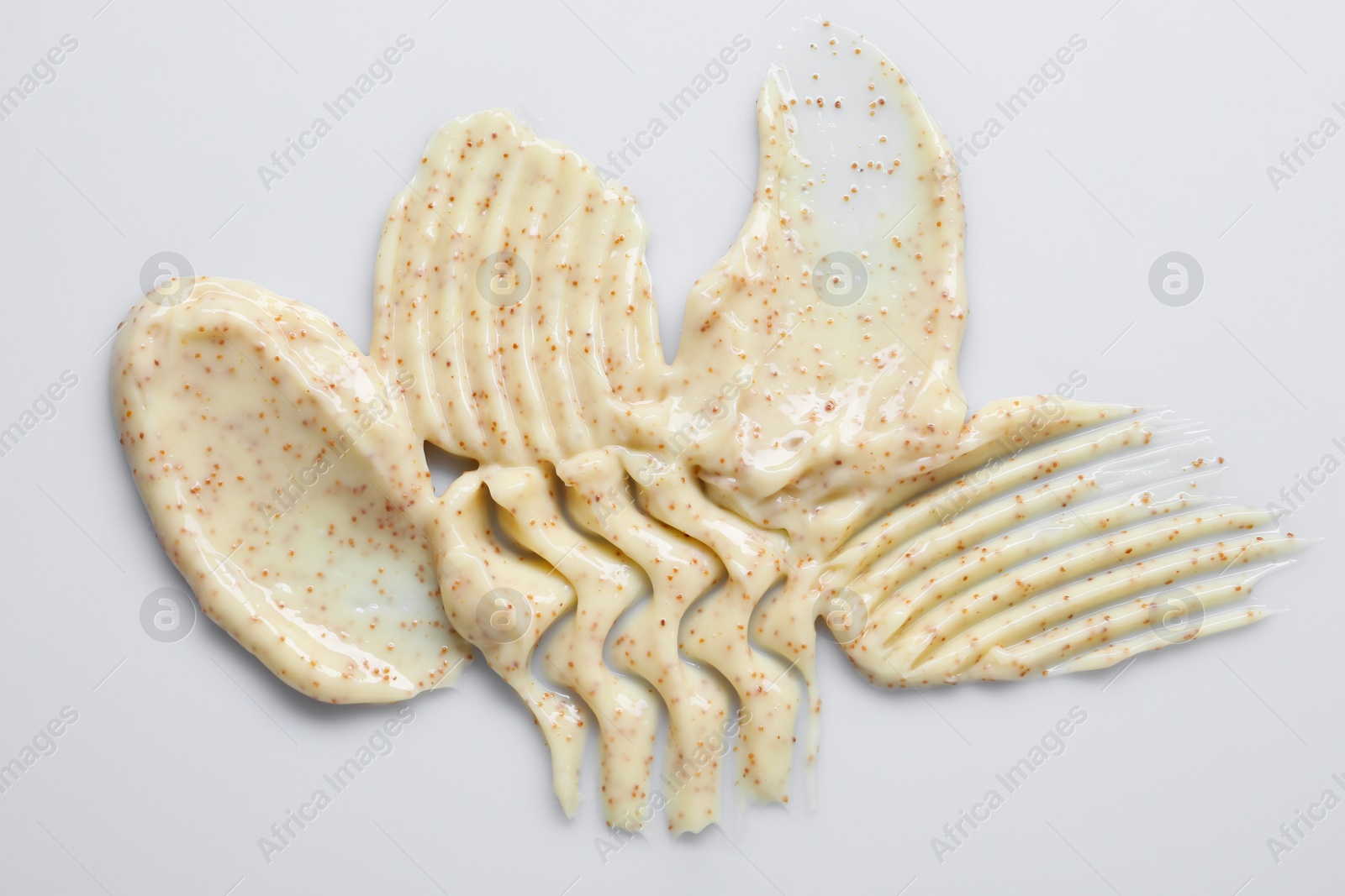 Photo of Samples of body scrub on light background, top view