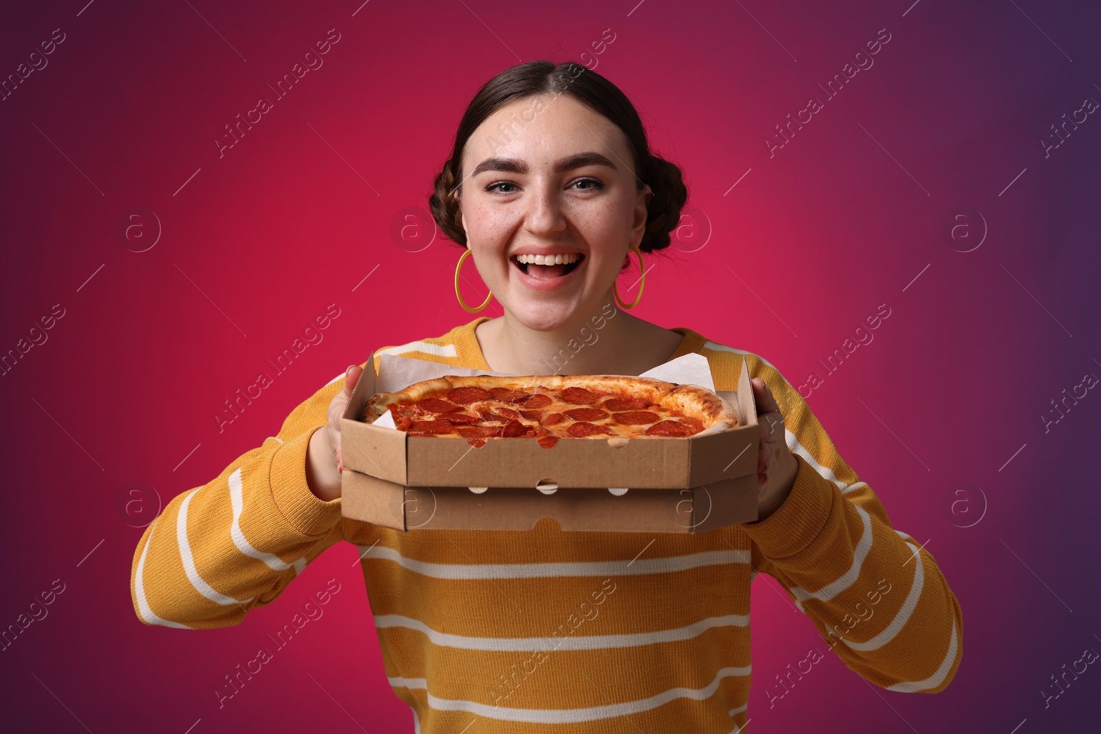 Photo of Beautiful woman with delicious pizza on bright background