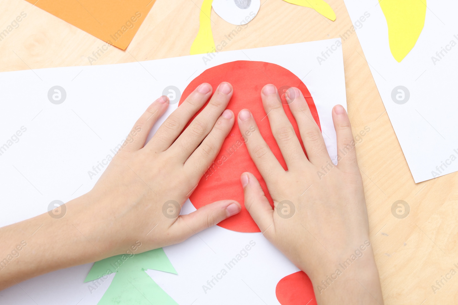 Photo of Girl making art project at table indoors, above view