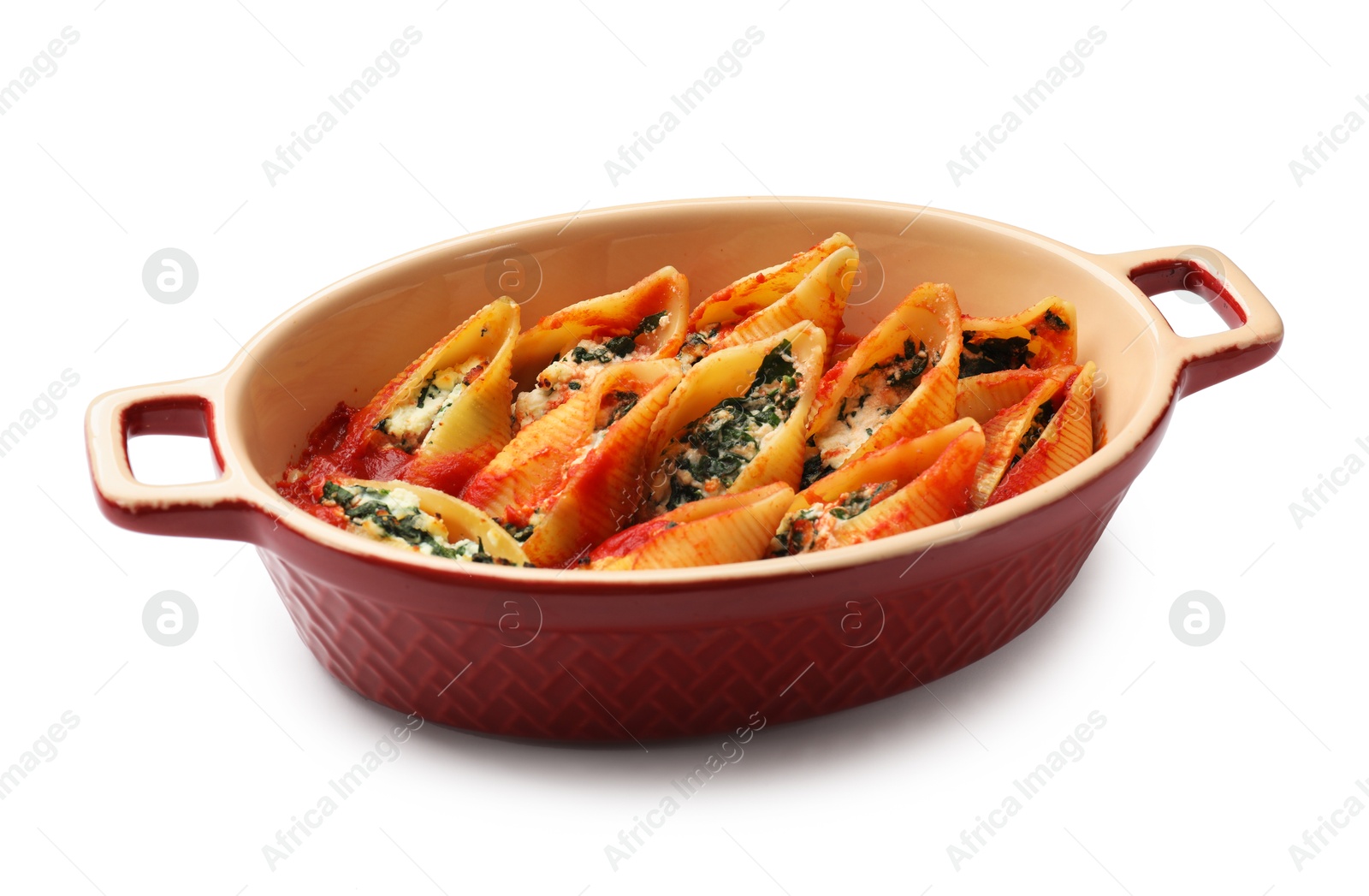 Photo of Delicious pasta with ricotta cheese, spinach and tomato sauce in baking dish isolated on white