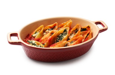 Photo of Delicious pasta with ricotta cheese, spinach and tomato sauce in baking dish isolated on white