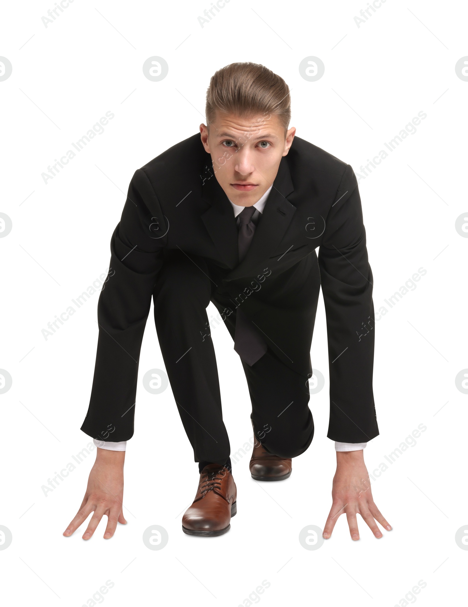 Photo of Businessman in starting position for run ready for competition on white background