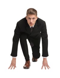 Photo of Businessman in starting position for run ready for competition on white background