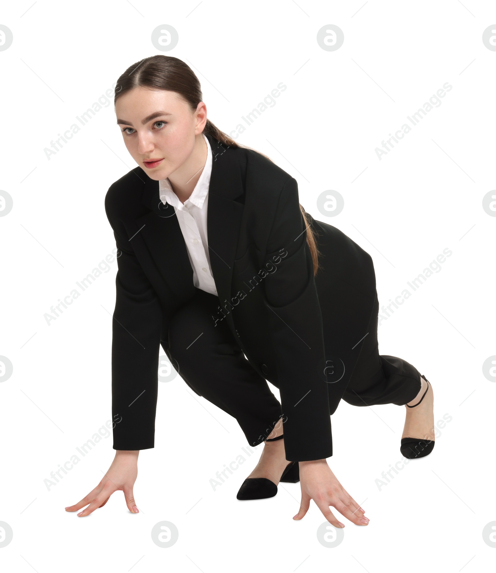 Photo of Businesswoman in starting position for run ready for competition on white background