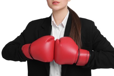 Competition. Businesswoman in suit wearing boxing gloves on white background, closeup