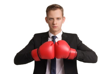 Photo of Competition. Businessman in suit wearing boxing gloves on white background