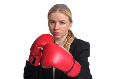 Photo of Competition. Businesswoman in suit wearing boxing gloves on white background