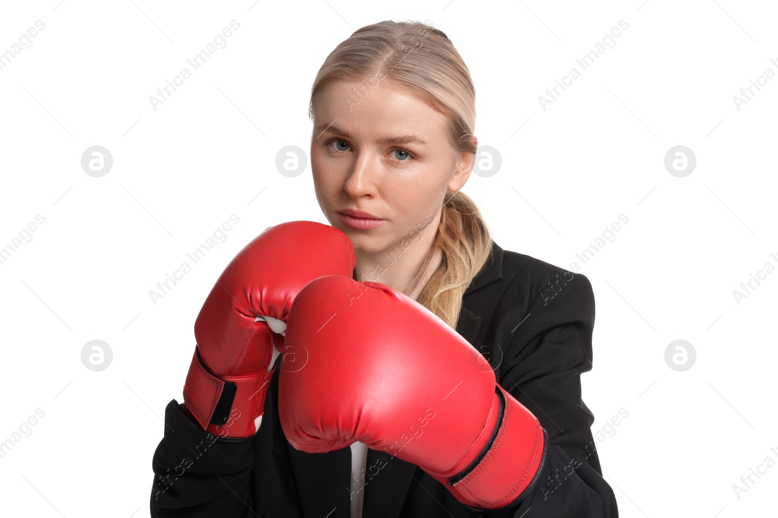 Photo of Competition. Businesswoman in suit wearing boxing gloves on white background