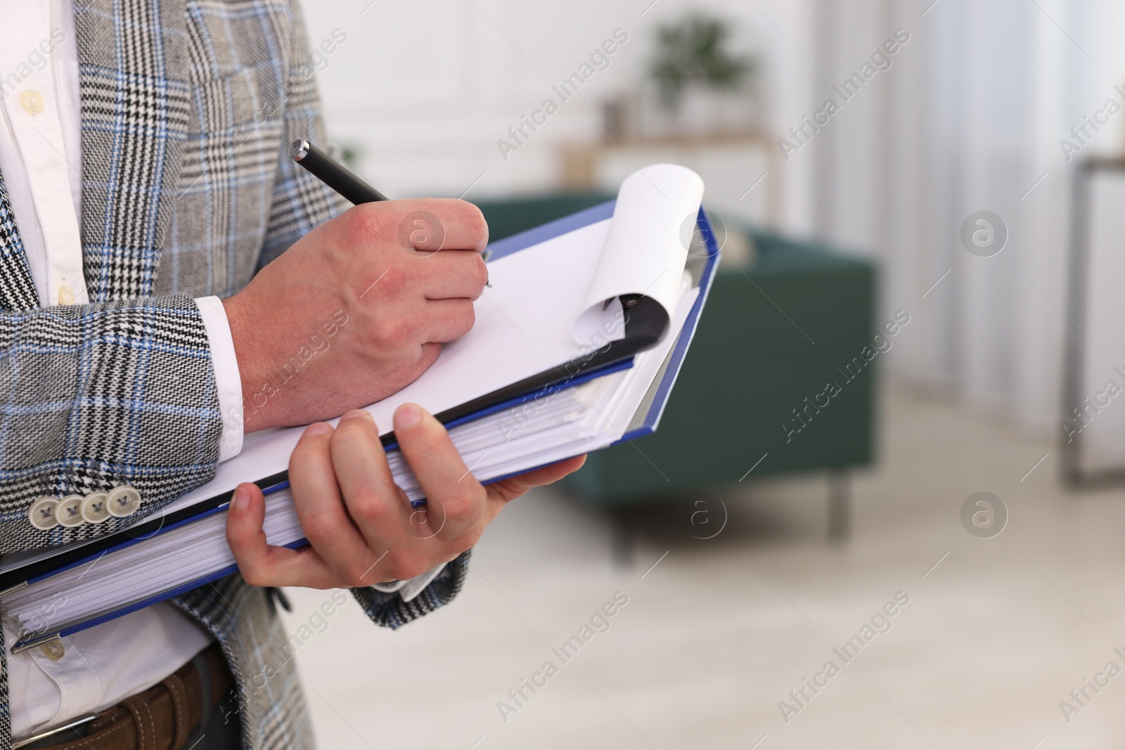 Photo of Real estate appraisal. Inspector with clipboard conducting property valuation at home, closeup