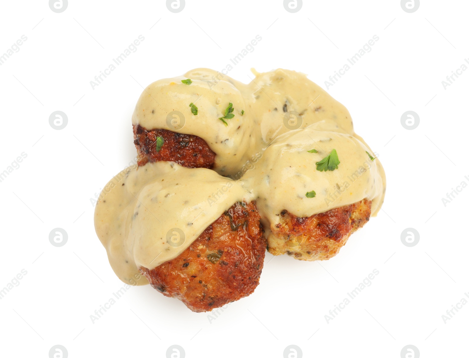 Photo of Delicious meatballs with creamy sauce isolated on white, top view