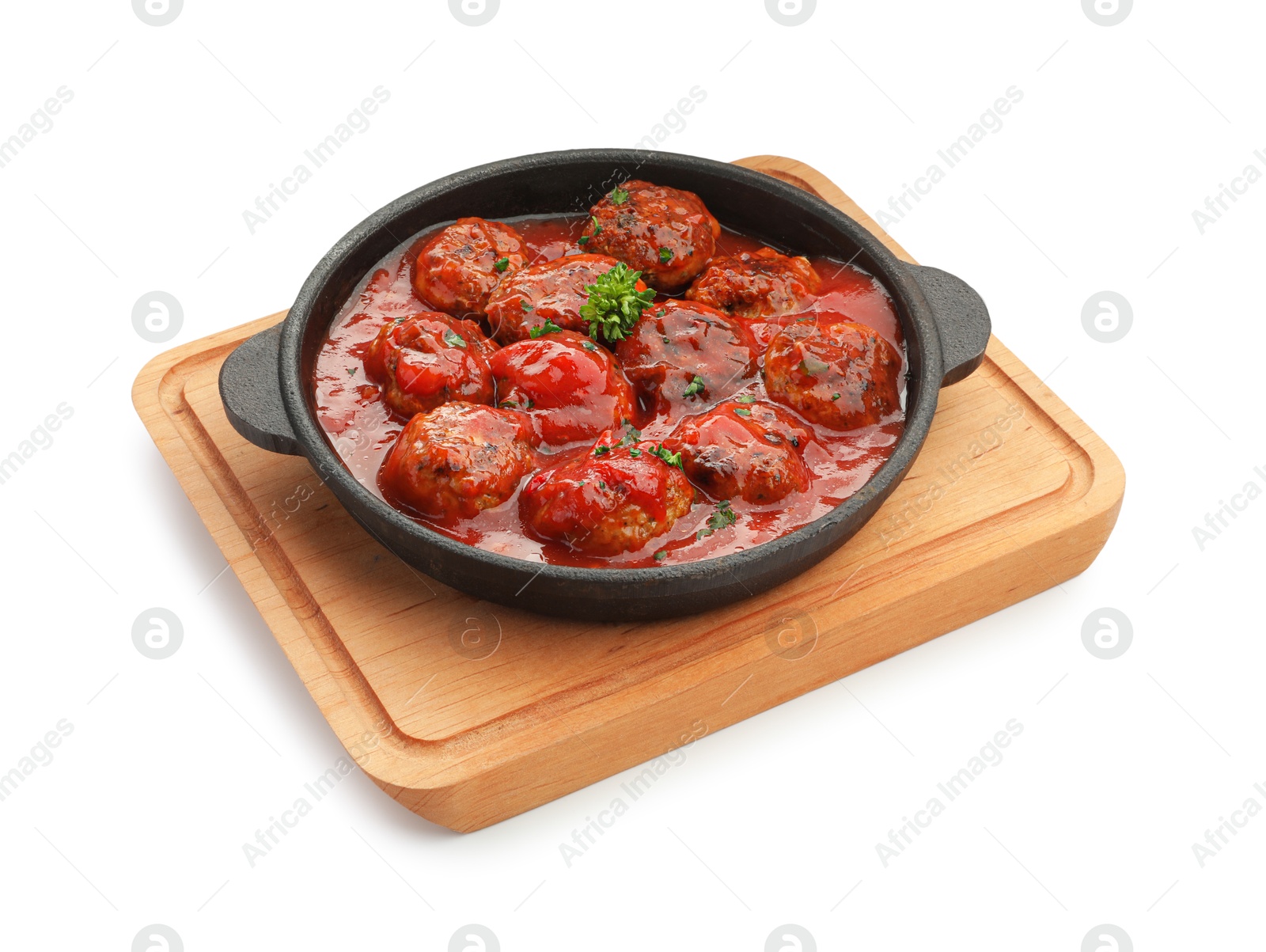 Photo of Delicious meatballs with tomato sauce in baking dish isolated on white