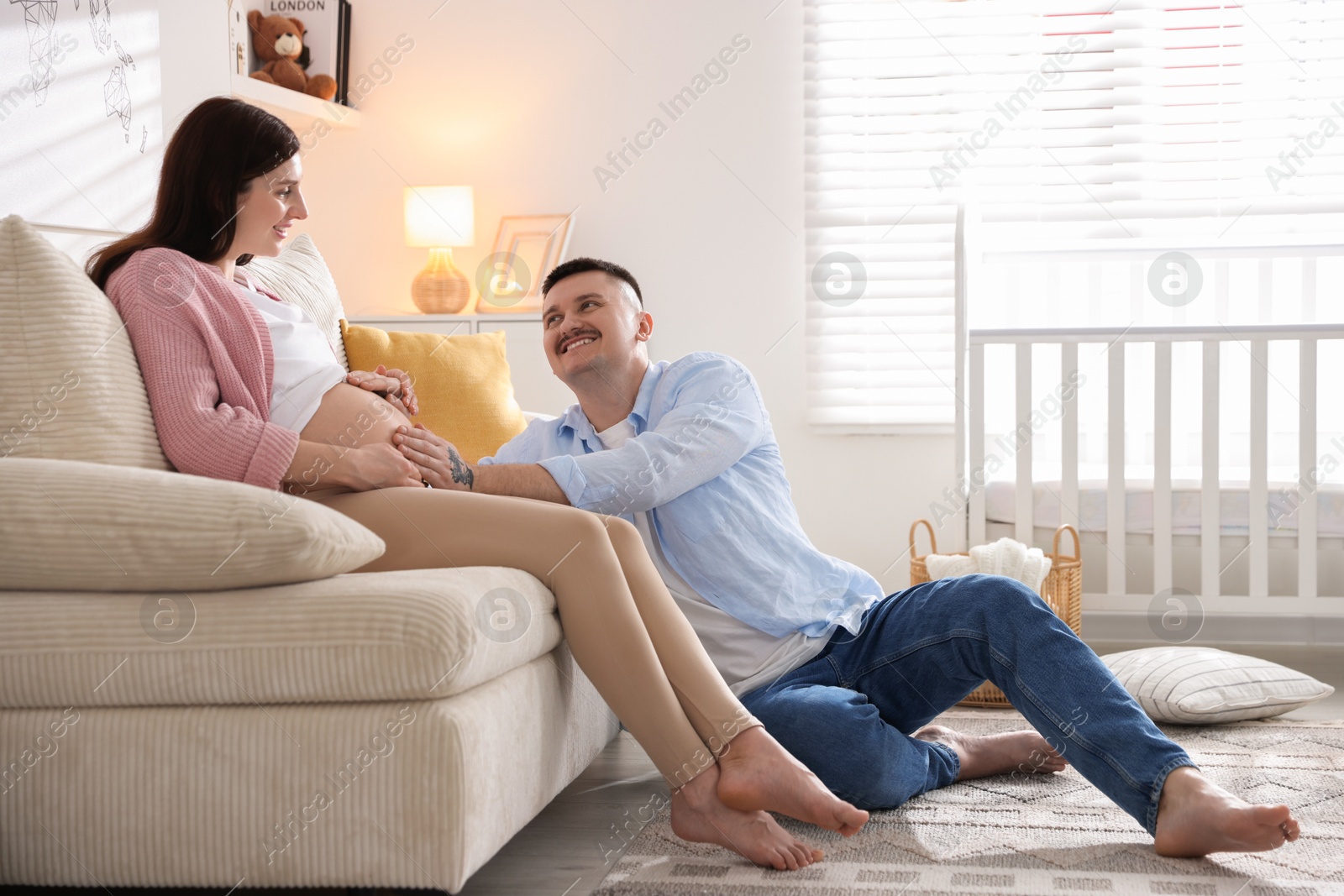 Photo of Pregnant woman and her husband at home