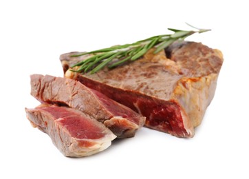 Photo of Pieces of delicious beef meat and rosemary isolated on white