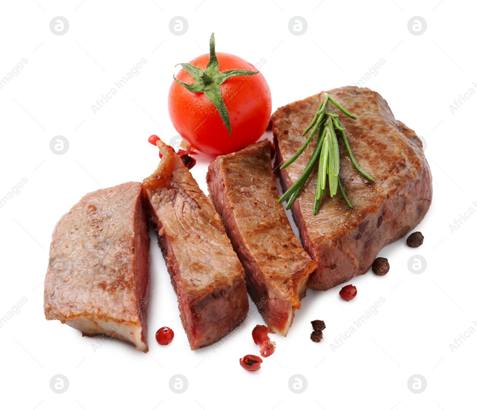 Photo of Pieces of delicious beef meat, spices and tomato isolated on white