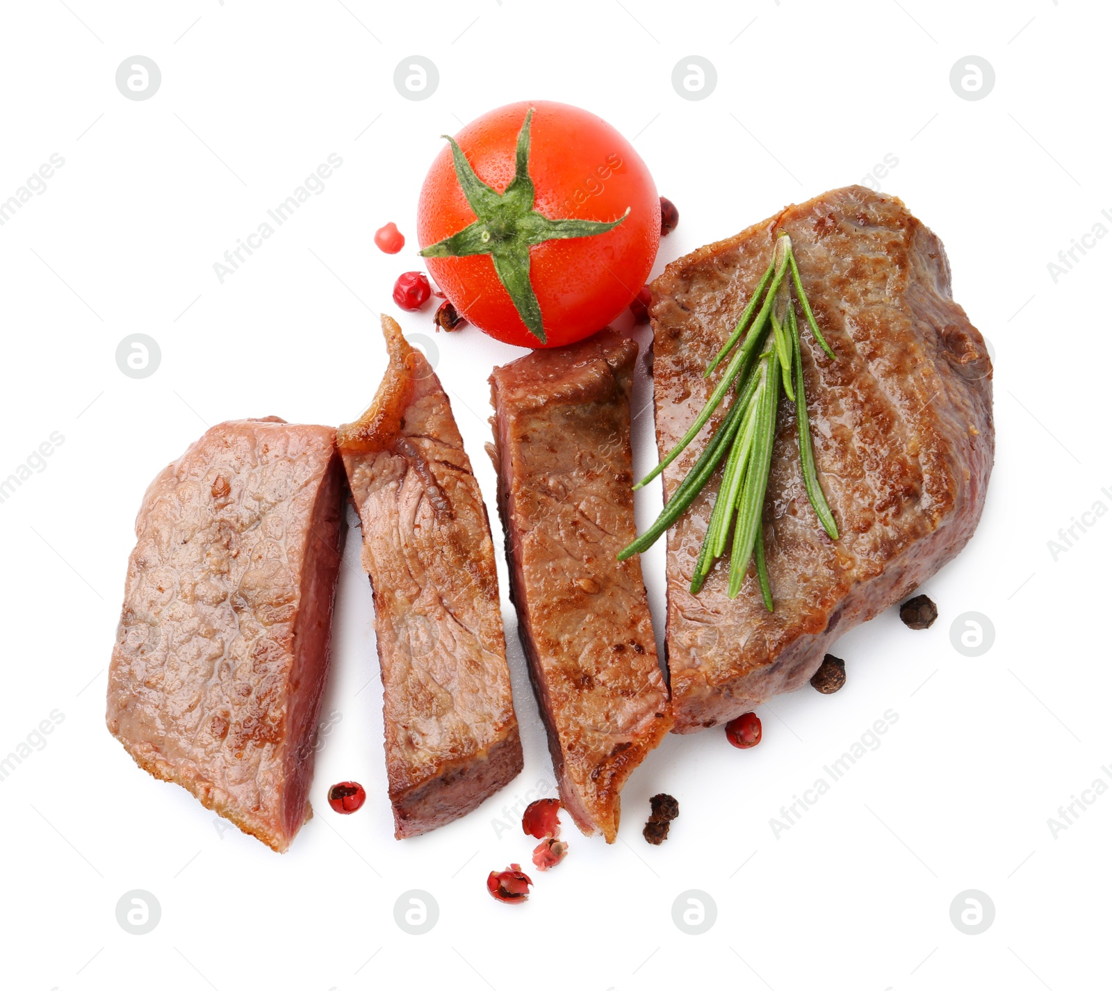 Photo of Pieces of delicious beef meat, spices and tomato isolated on white, top view