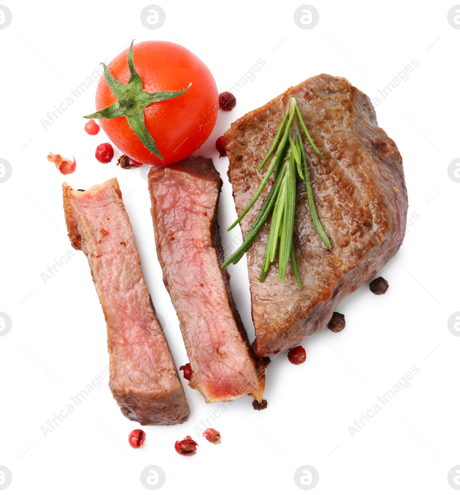 Photo of Pieces of delicious beef meat, spices and tomato isolated on white, top view