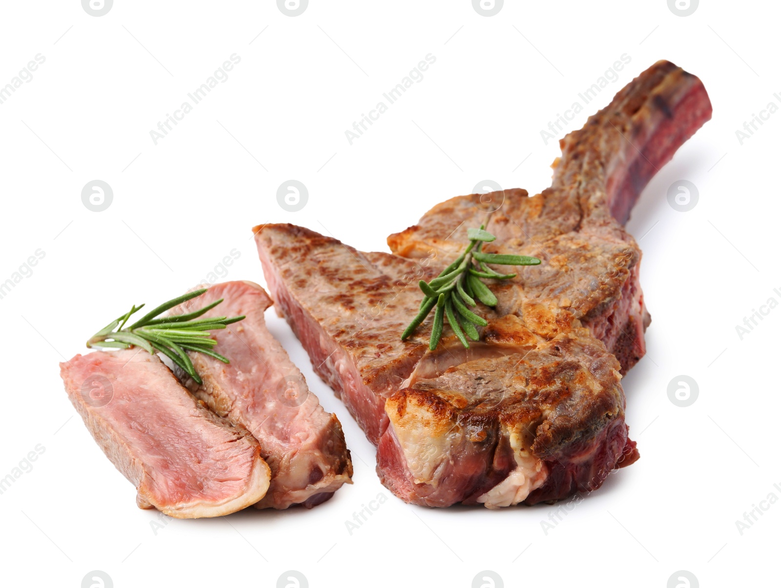 Photo of Pieces of delicious beef meat and rosemary isolated on white