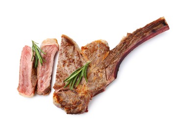 Photo of Pieces of delicious beef meat and rosemary isolated on white, top view