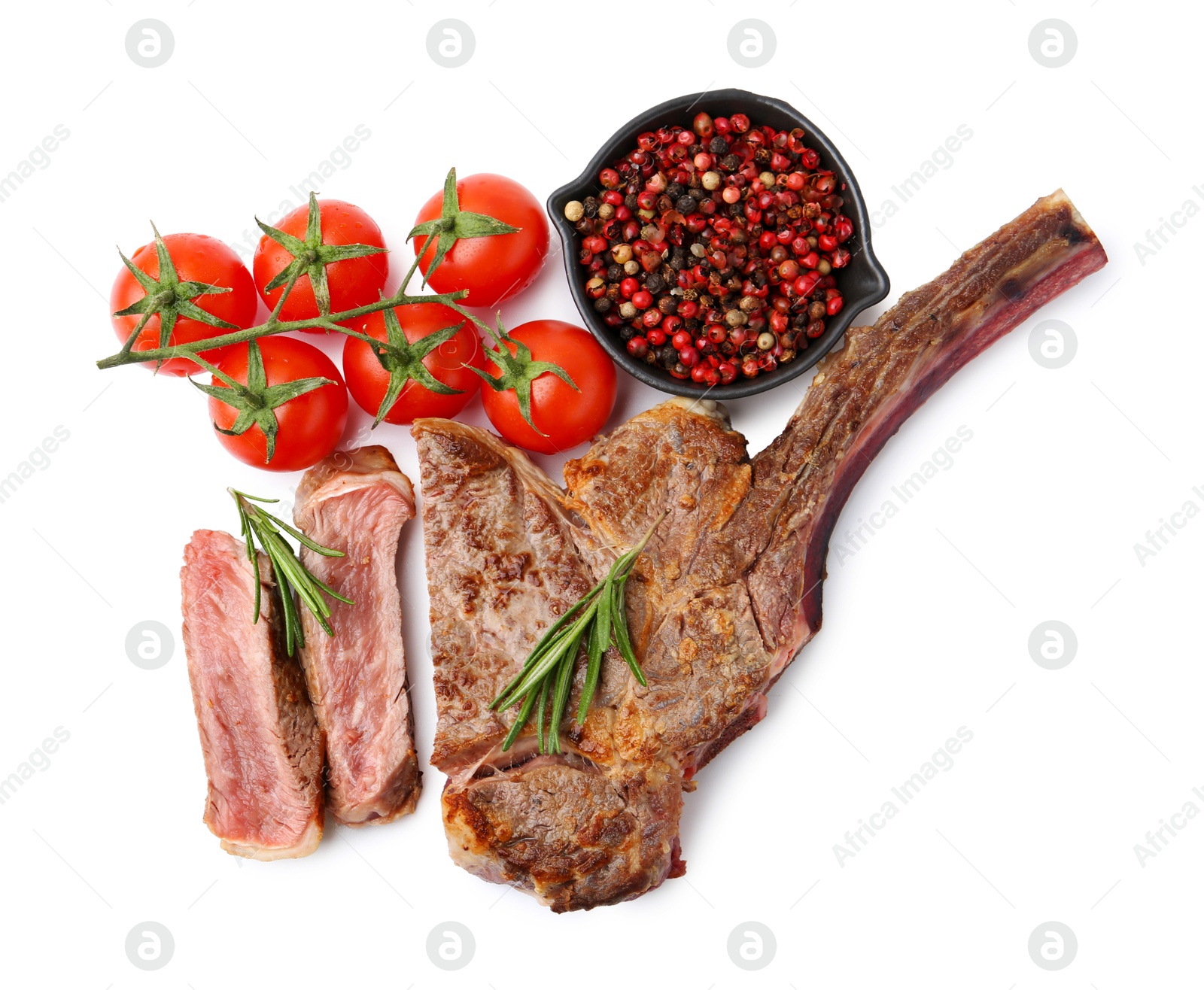 Photo of Pieces of delicious beef meat, spices and tomatoes isolated on white, top view