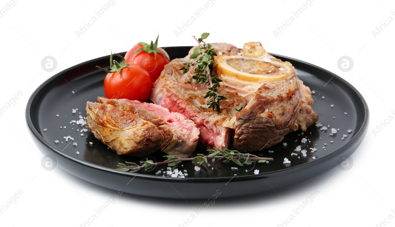 Photo of Pieces of delicious beef meat, thyme, salt and tomatoes isolated on white