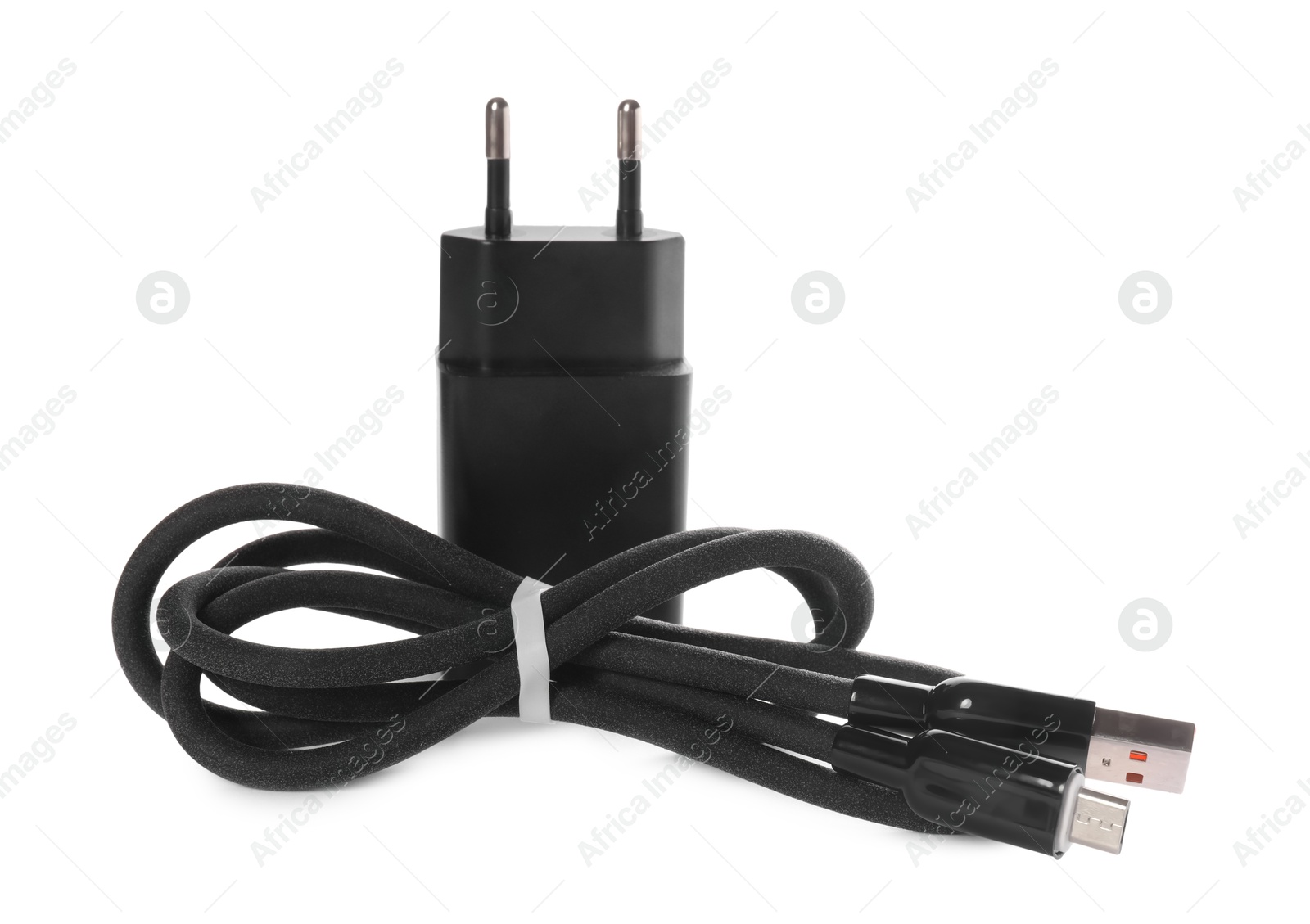 Photo of USB power adapter and charge cable isolated on white