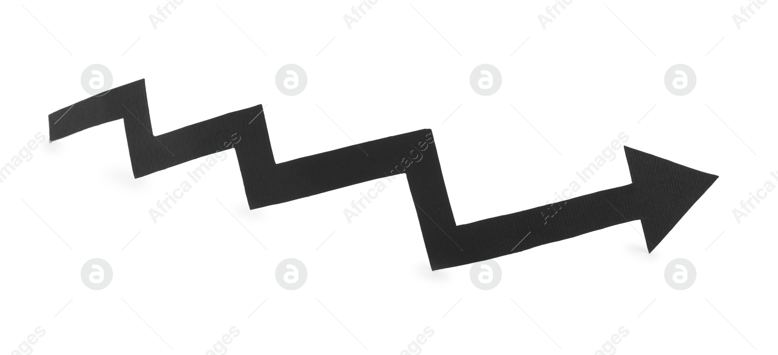 Photo of One black paper arrow isolated on white