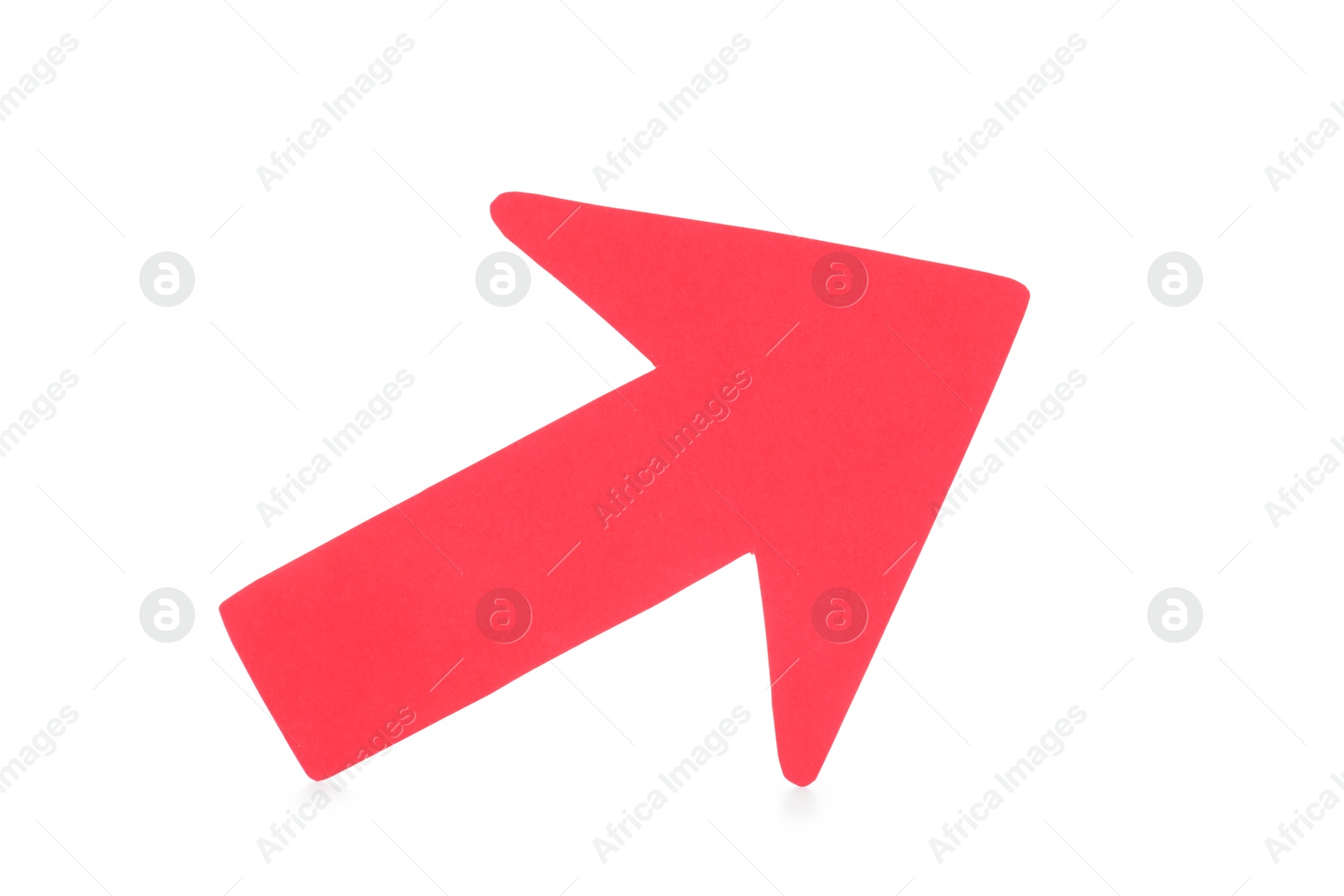 Photo of One red paper arrow isolated on white