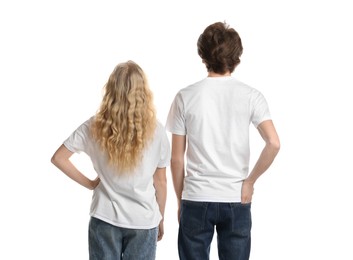 Photo of Young woman and man wearing blank t-shirts on white background. Mockup for design