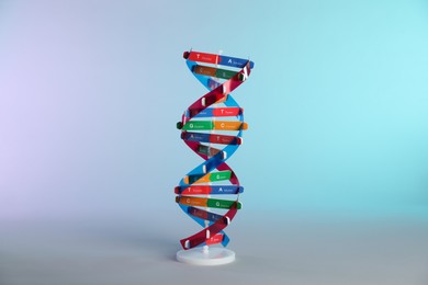 Photo of One DNA structure model on color background