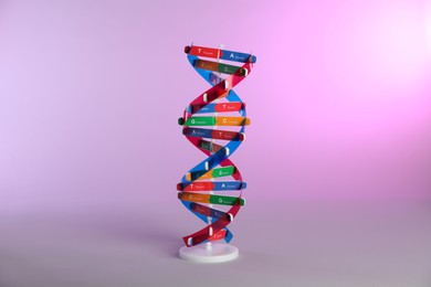 Photo of One DNA structure model on color background