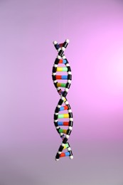 Photo of One DNA structure model on color background