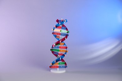 Photo of One DNA structure model on color background