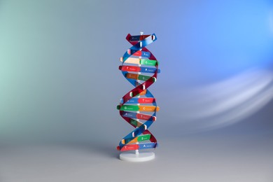 Photo of One DNA structure model on color background