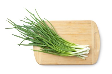 Photo of Wooden cutting board with green onions isolated on white, top view