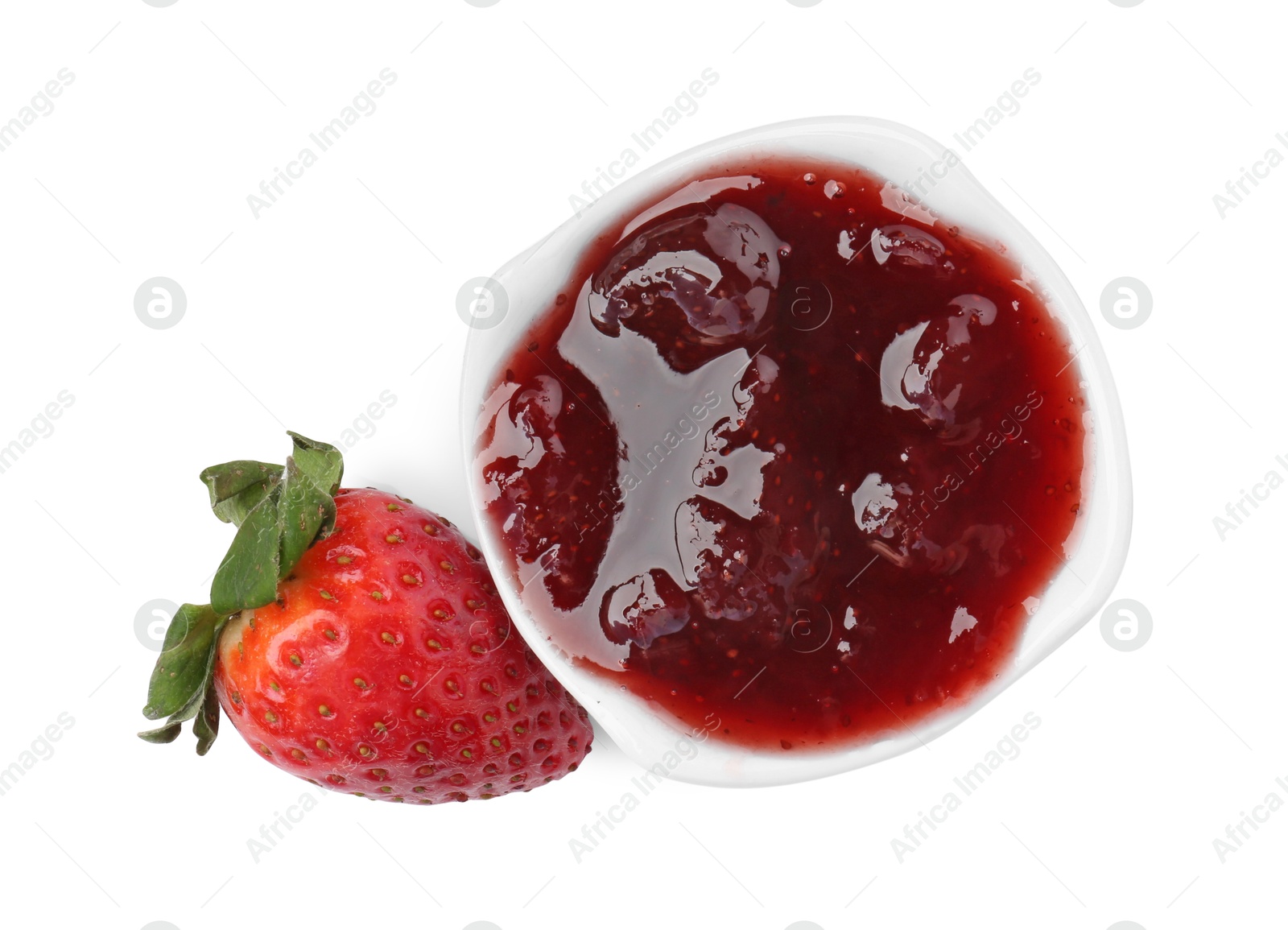 Photo of Tasty strawberry sauce in bowl and fresh berry isolated on white, top view