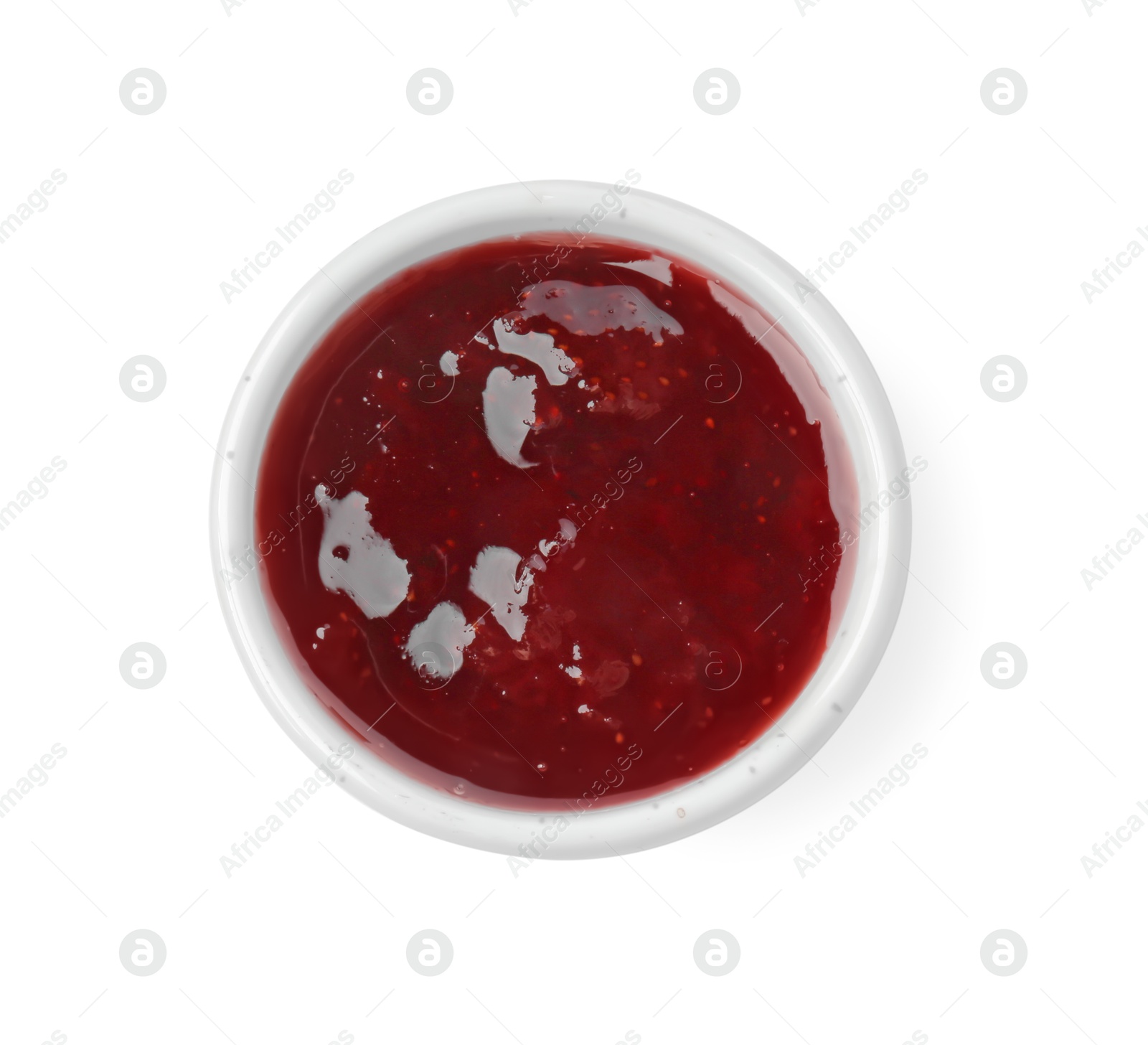 Photo of Tasty strawberry sauce in bowl isolated on white, top view