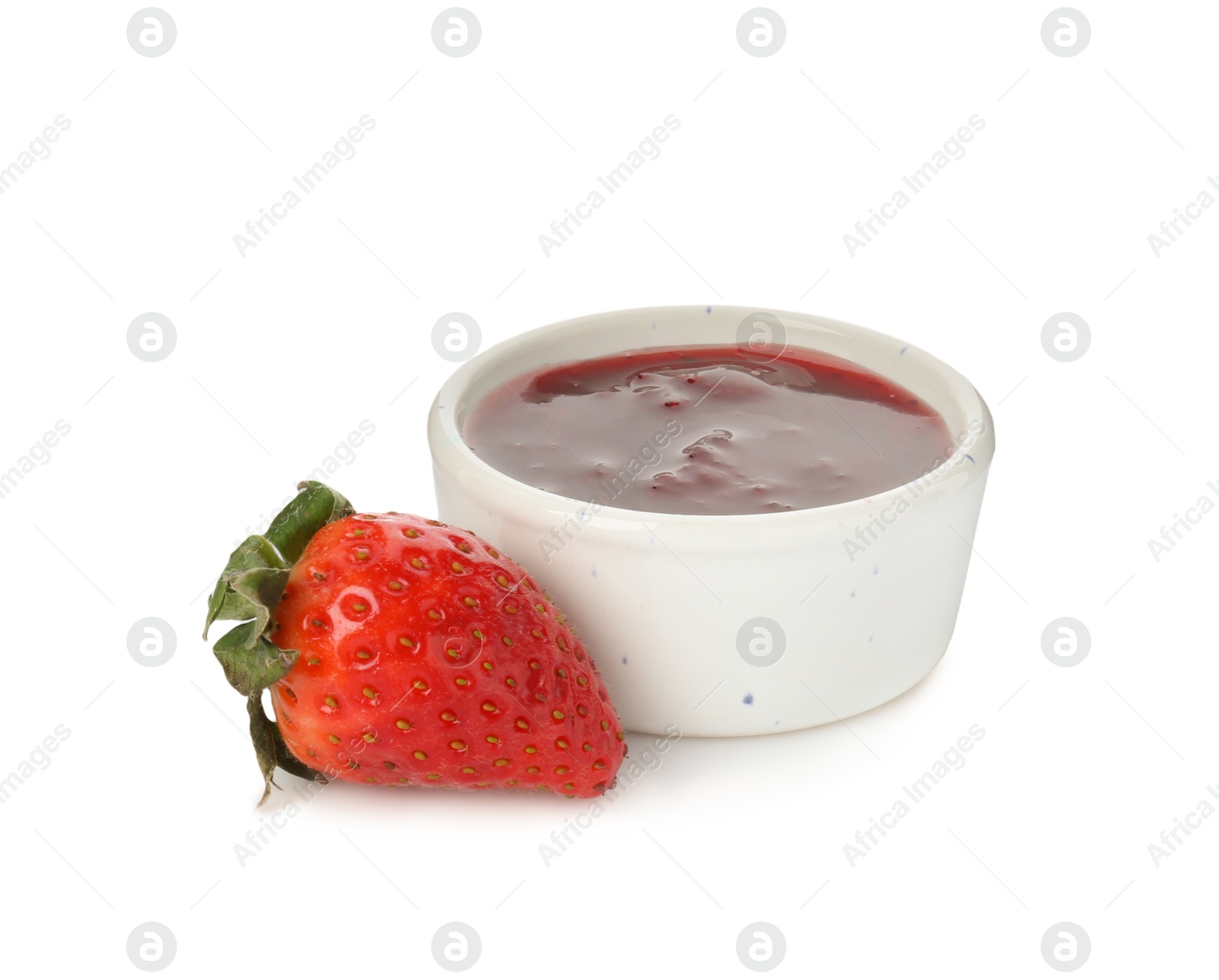 Photo of Tasty strawberry sauce in bowl and fresh berry isolated on white