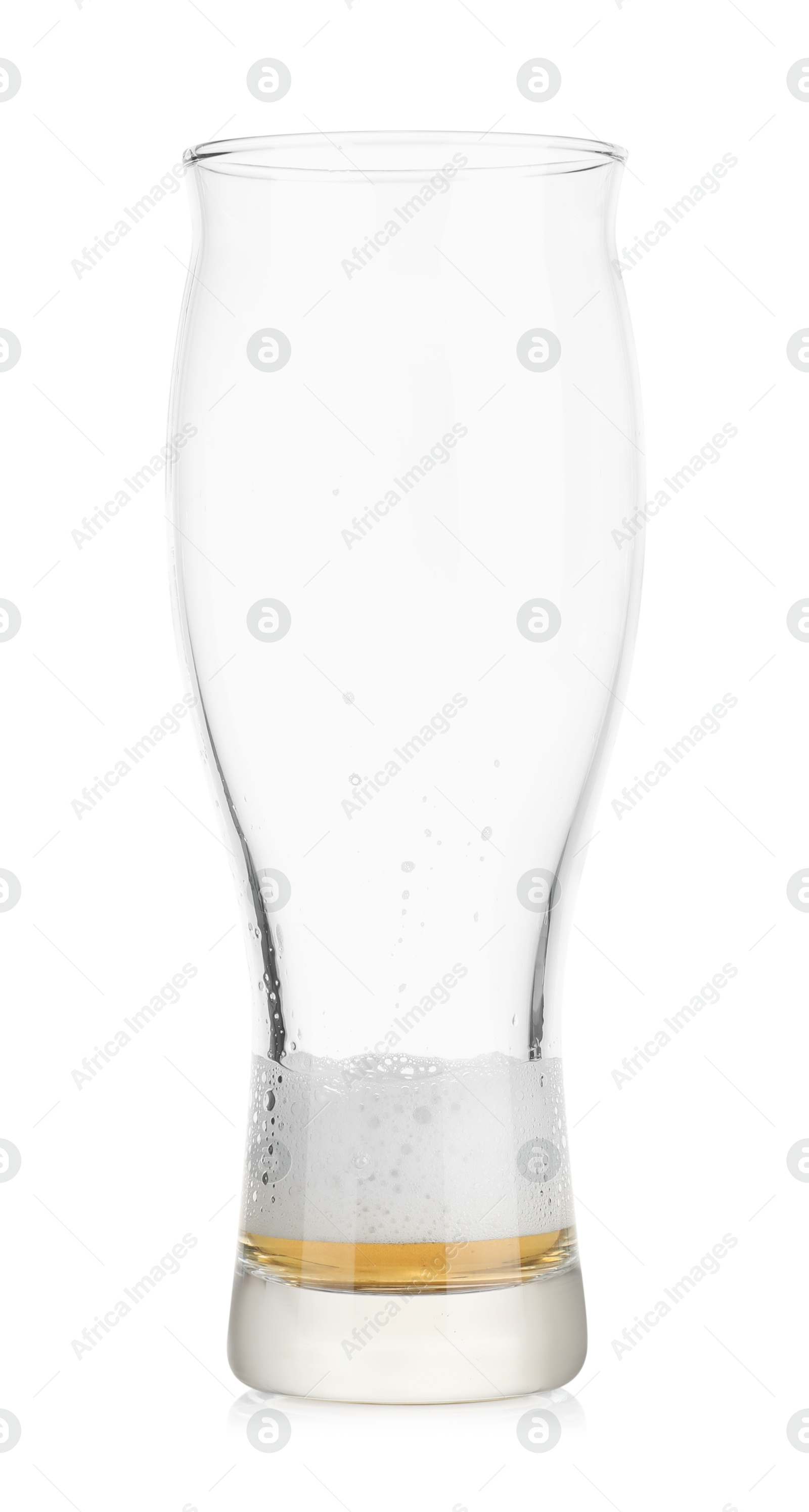 Photo of Almost empty glass of beer isolated on white