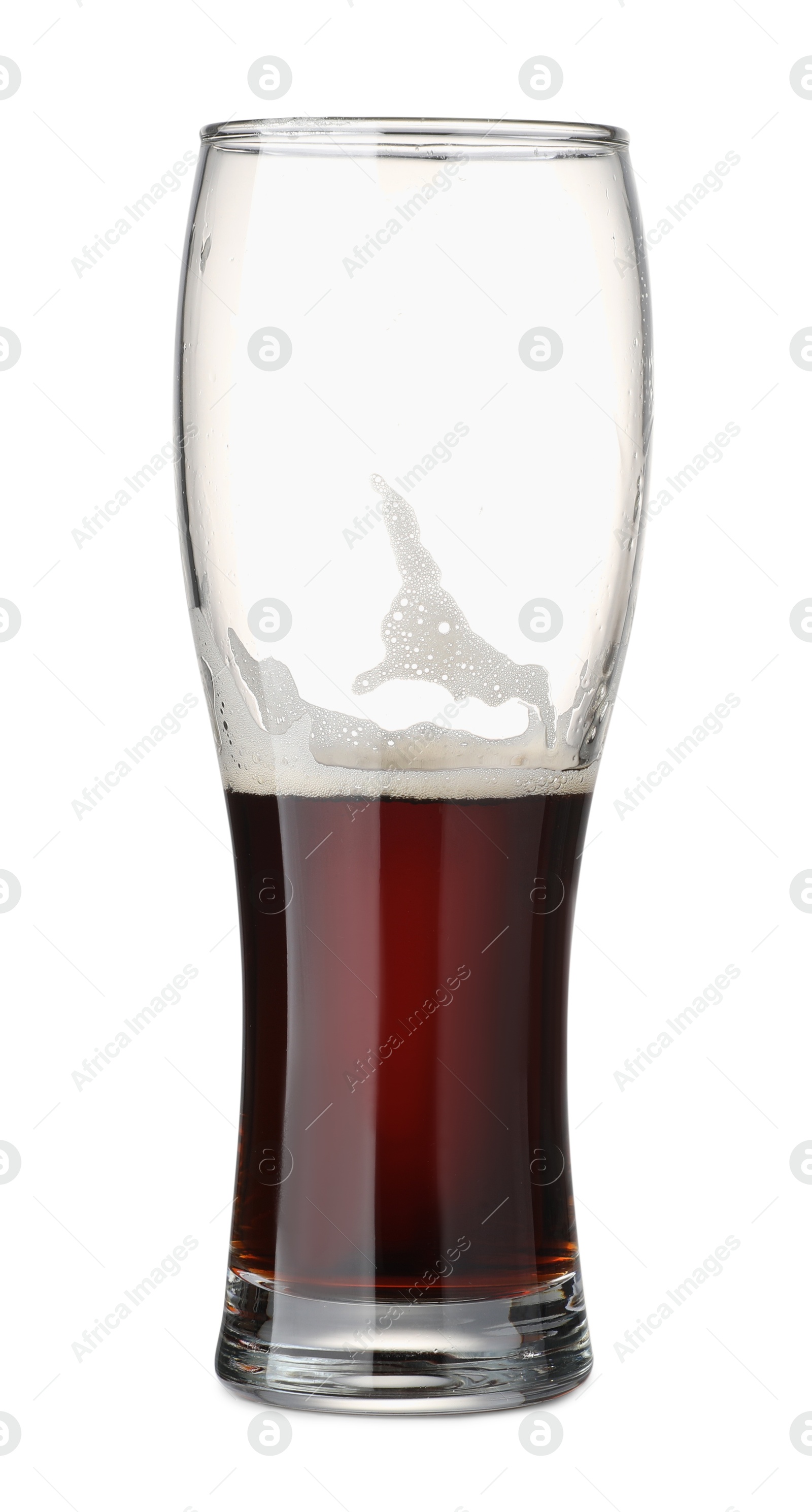 Photo of Half full glass of beer isolated on white