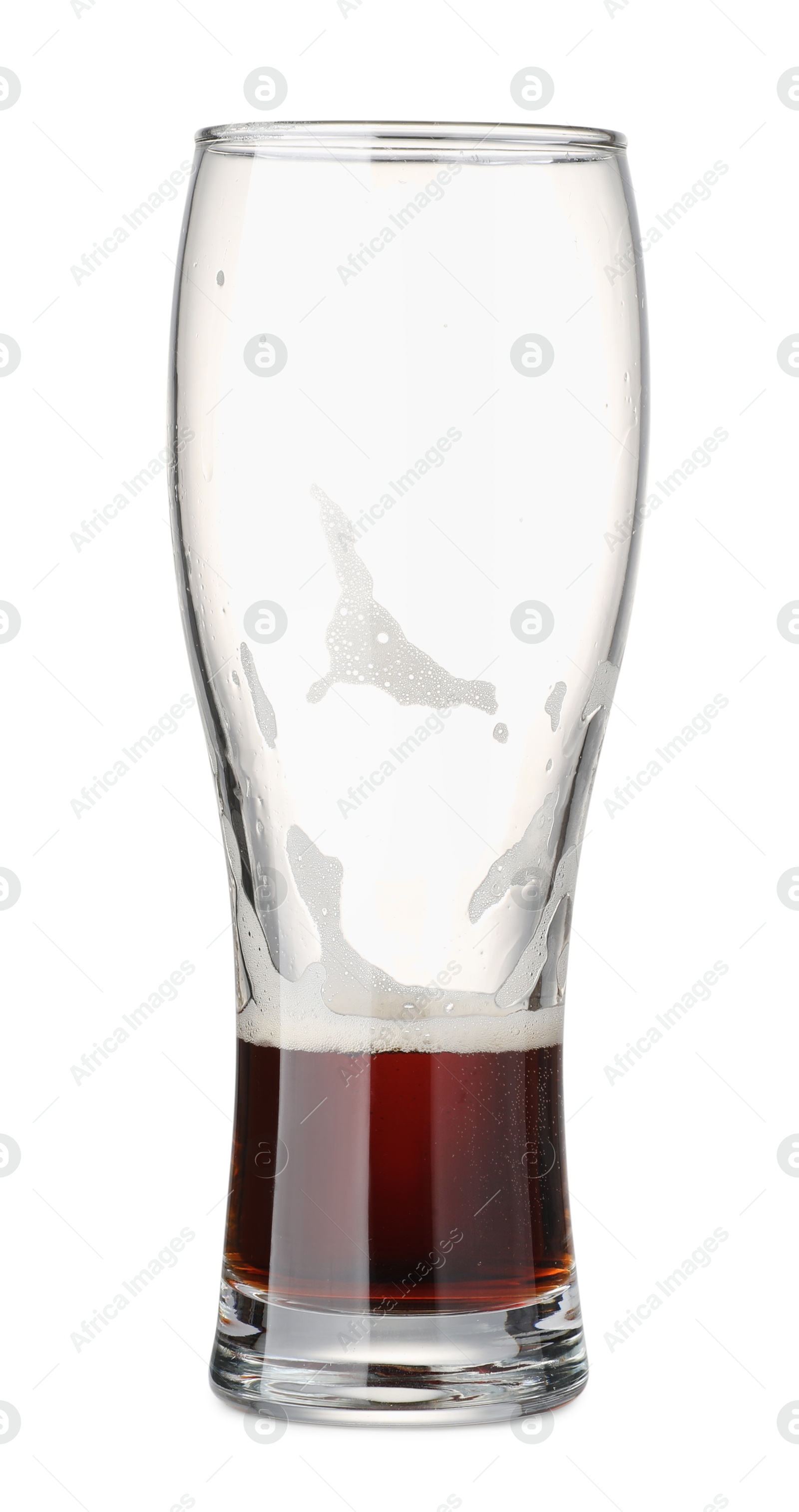 Photo of Almost empty glass of beer isolated on white