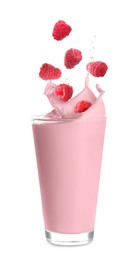 Raspberry milkshake and fresh berries on white background