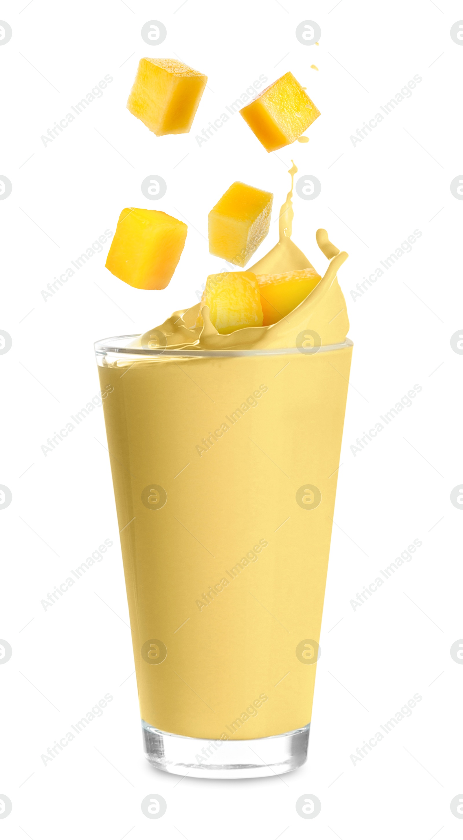 Image of Mango milkshake and pieces of fresh fruit on white background