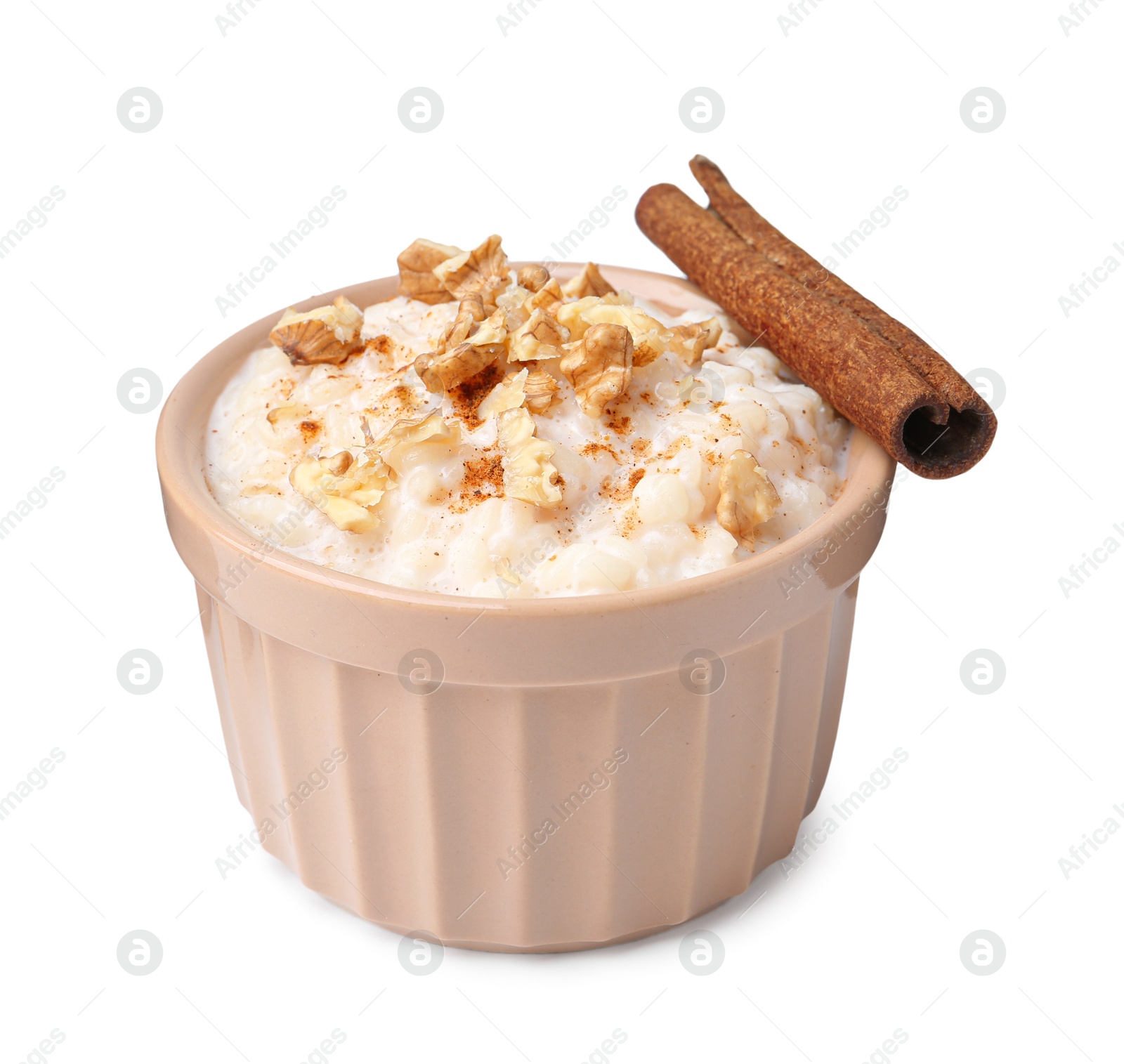 Photo of Tasty rice pudding with walnuts and cinnamon isolated on white