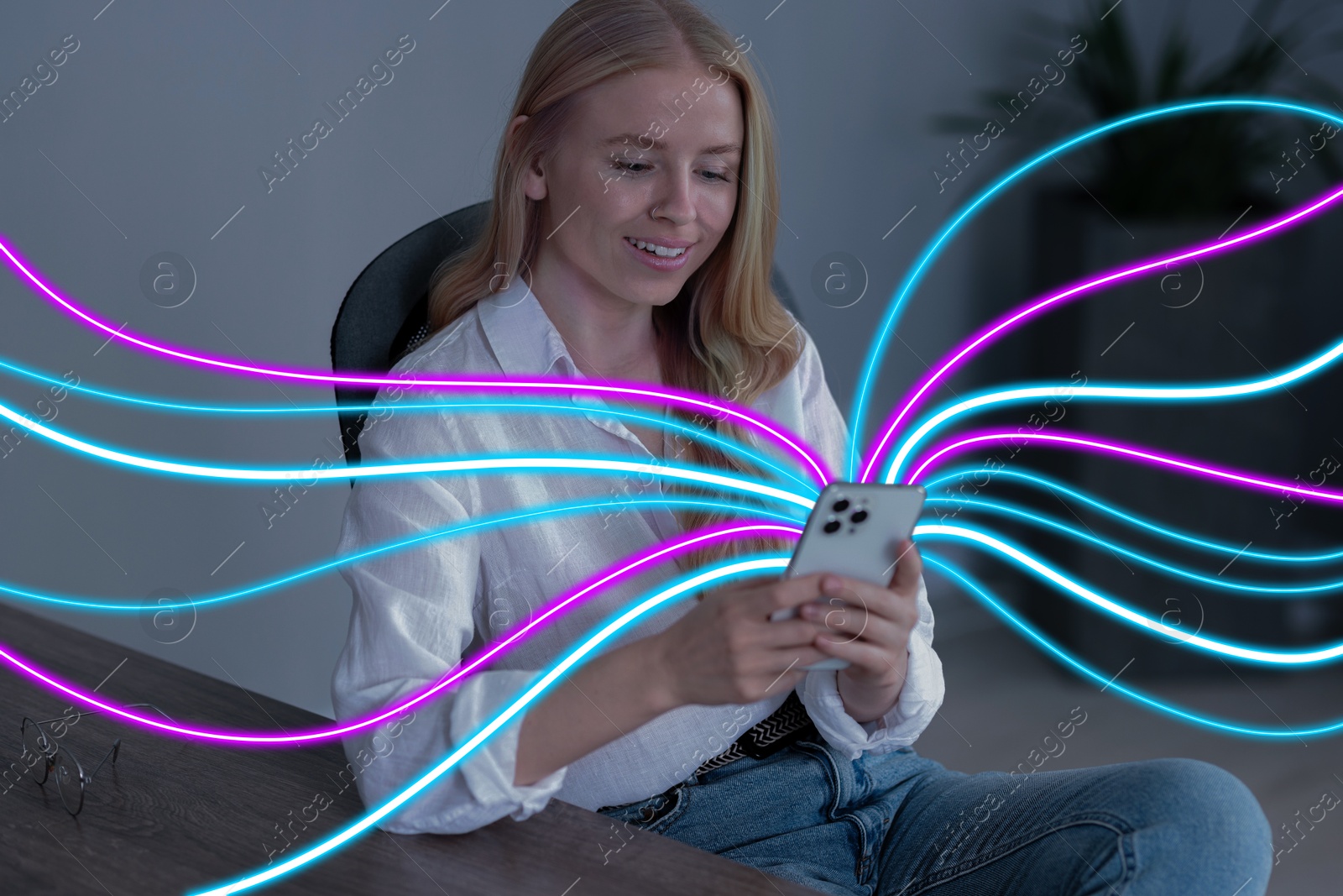 Image of Happy woman using mobile phone indoors. Bright lines coming out of device symbolizing high speed internet