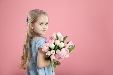 Photo of Cute little girl with bouquet of beautiful spring flowers on pink background, space for text