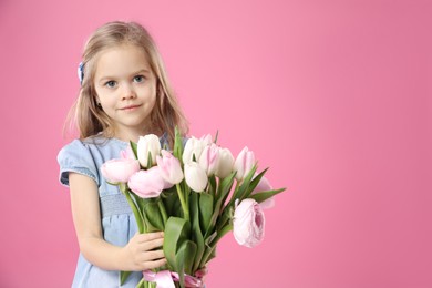 Photo of Cute little girl with bouquet of beautiful spring flowers on pink background, space for text