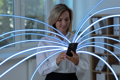 Image of Happy woman using mobile phone indoors. Bright lines coming out of device symbolizing high speed internet