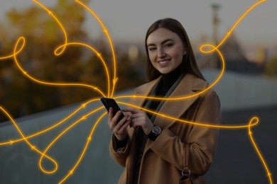 Happy woman using mobile phone outdoors. Bright lines coming out of device symbolizing high speed internet