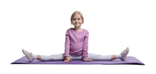 Little girl exercising on fitness mat against white background. Sport activity